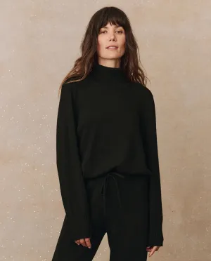 The Cashmere Turtleneck Sweater. -- Black